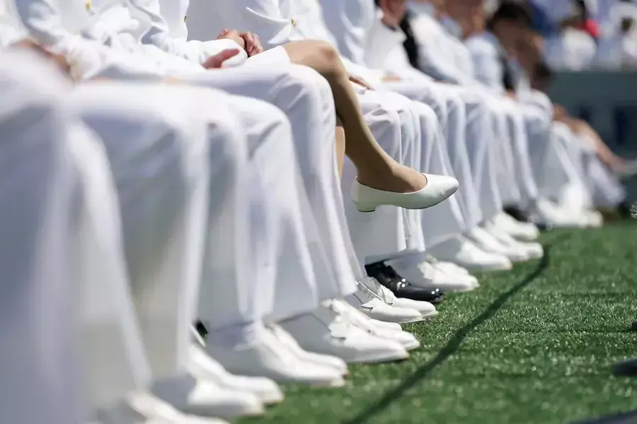 Graduating midshipmen listen to proceedings during the U.S. Naval Academy graduation and commissioning ceremony in Annapolis, Maryland, U.S., May 26, 2023.