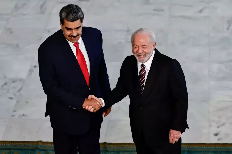 Venezuela’s President Nicolás Maduro shakes hands with Brazil’s President Luiz Inácio Lula da Silva as they meet before a summit with presidents of South America, in Brasília, Brazil, May 29, 2023.