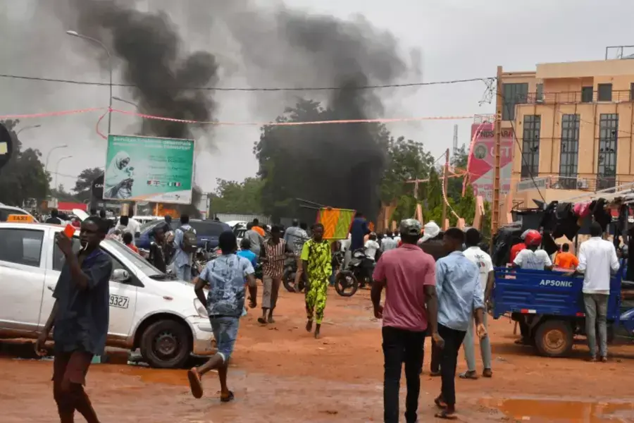  A general view of billowing smoke as supporters of the Nigerien defense and security forces attack the headquarters of the Nigerien Party for Democracy and Socialism (PNDS), the party of overthrown President Mohamed Bazoum, in Niamey on July 27, 2023.