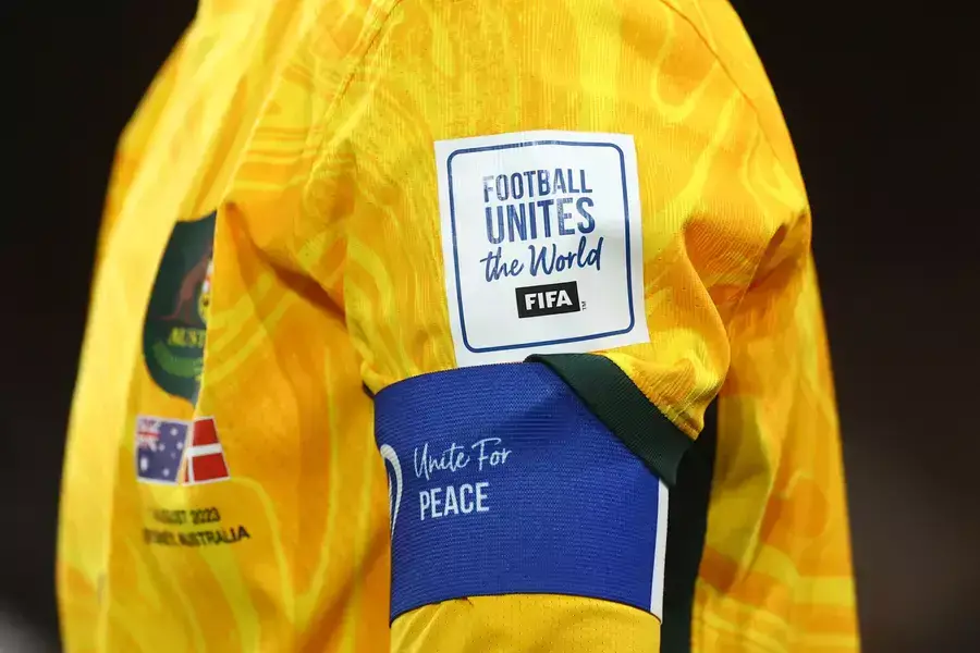 Soccer Football - FIFA Women’s World Cup Australia and New Zealand 2023 - Round of 16 - Australia v Denmark - Stadium Australia, Sydney, Australia - August 7, 2023 General view of messages displayed on the shirt and captains armband of Australia's Steph C