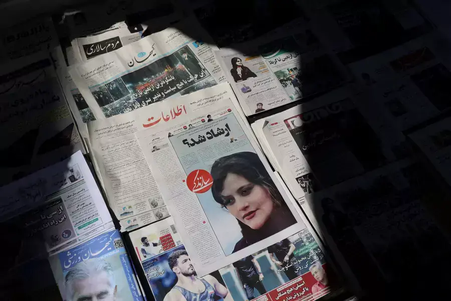 A newspaper with a cover picture of Mahsa Amini, a woman who died after being arrested by the Islamic republic's "morality police" is seen in Tehran, Iran September 18, 2022.
