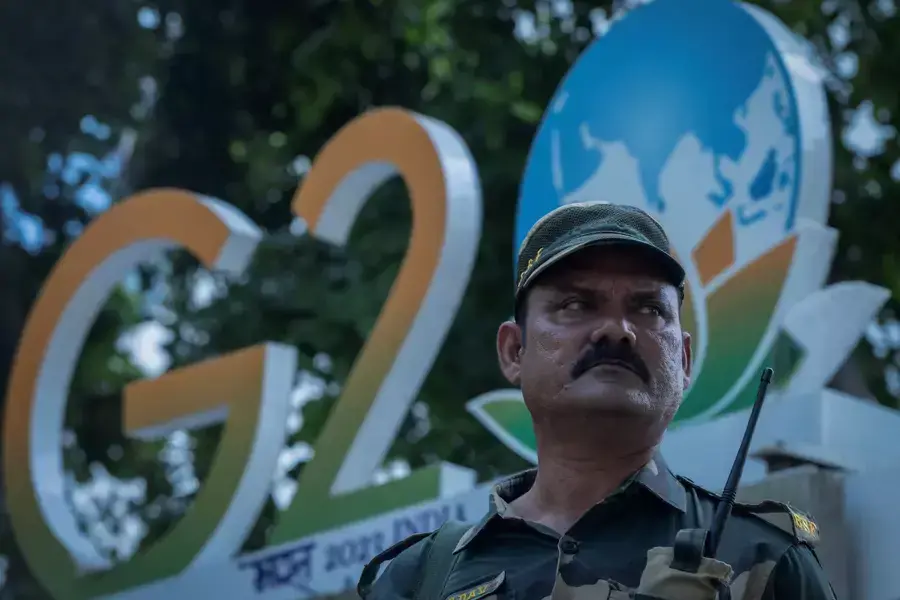 A paramilitary soldier stands guard outside a hotel during a rehearsal ahead of the G20 Summit in New Delhi, India.