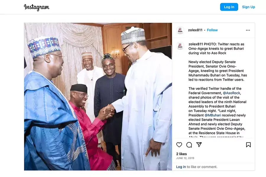 Former Deputy President of the Senate of Nigeria kneeling to greet former President Muhammad Buhari