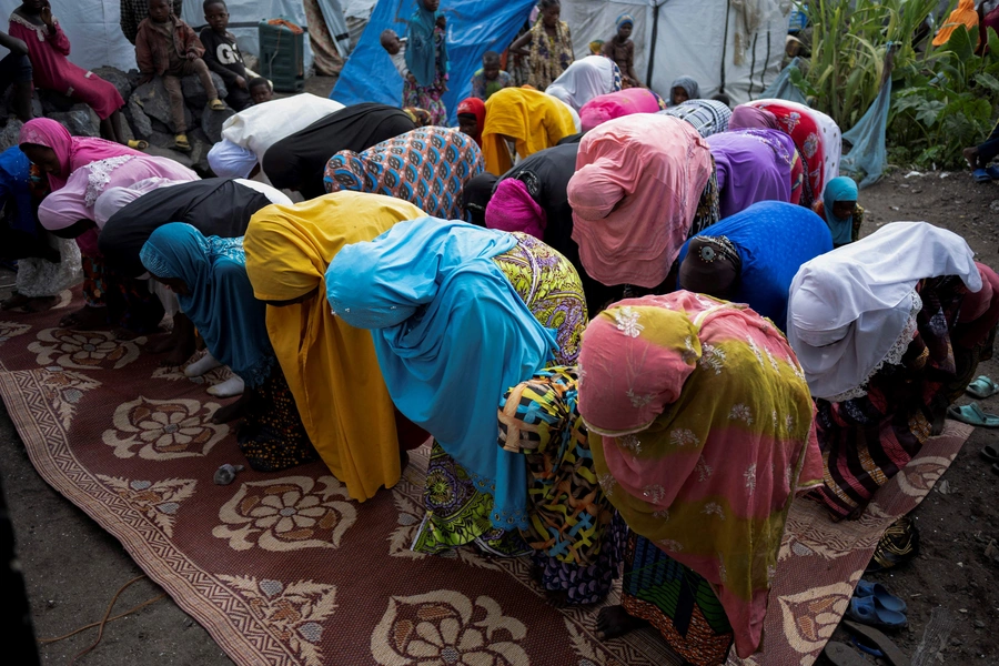 Internally displaced Congolese Muslim women attend Eid al-Fitr prayers in the Munigi camp site near Goma in the North Kivu province of the Democratic Republic of Congo, April 21, 2023.