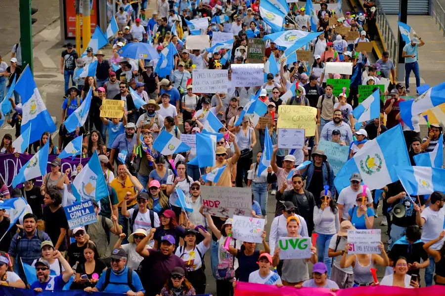 Guatemalan citizens participate in a national protest to demand the resignation of senior prosecutors accused of attempting to undermine President-elect Bernardo Arévalo's ability to take office.