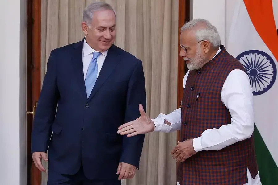 Indian Prime Minister Narendra Modi extends his hand for a handshake with his Israeli counterpart Benjamin Netanyahu during a meeting in New Delhi.