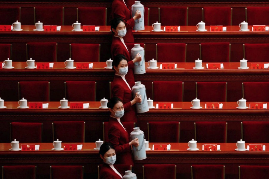 Attendants carry tea before the opening ceremony of the Twentieth National Congress of the Chinese Communist Party held in the Great Hall of the People in Beijing, China.