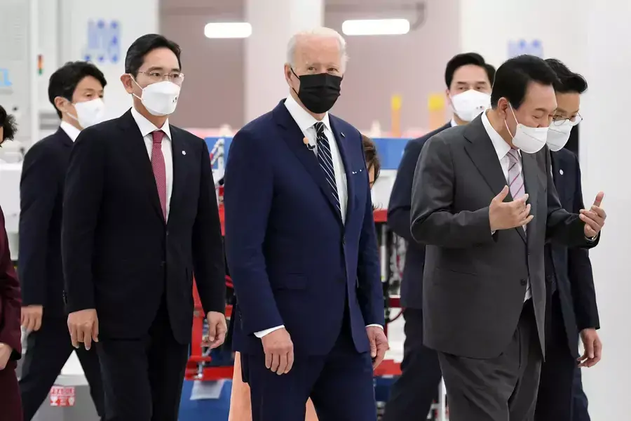 U.S. President Joe Biden, South Korean President Yoon Suk Yeol, and Samsung Electronics Co. Vice Chairman Lee Jae-yong walk at the Samsung Electronic Pyeongtaek Campus in South Korea on May 20 2022. 