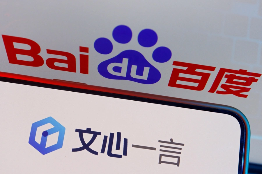 The logo of Baidu's AI chatbot Ernie Bot is displayed near a screen showing the Baidu logo, in this illustration picture taken June 28, 2023