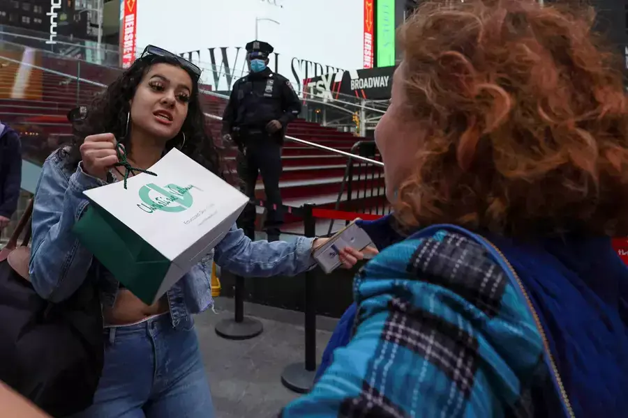 Pro-Palestine supporter confronts a Pro-Israel protester during a rally at Times Square in New York City
