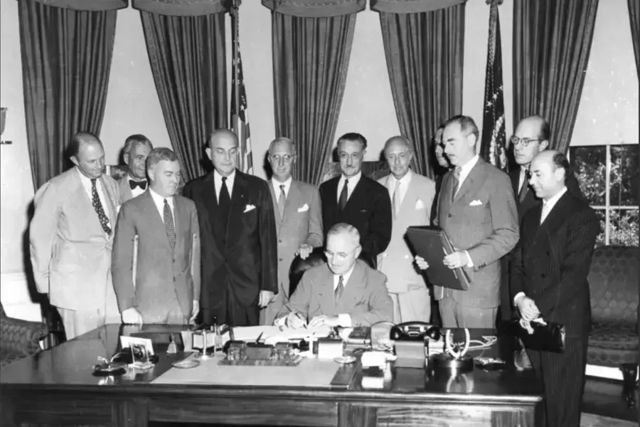 President Harry Truman signs the North Atlantic Treaty in Washington, DC, on August 29, 1949.