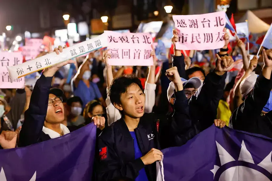 Supporters of the opposition party Kuomintang (KMT) celebrate the preliminary results of the local elections during a rally in Taipei, Taiwan on November 26, 2022