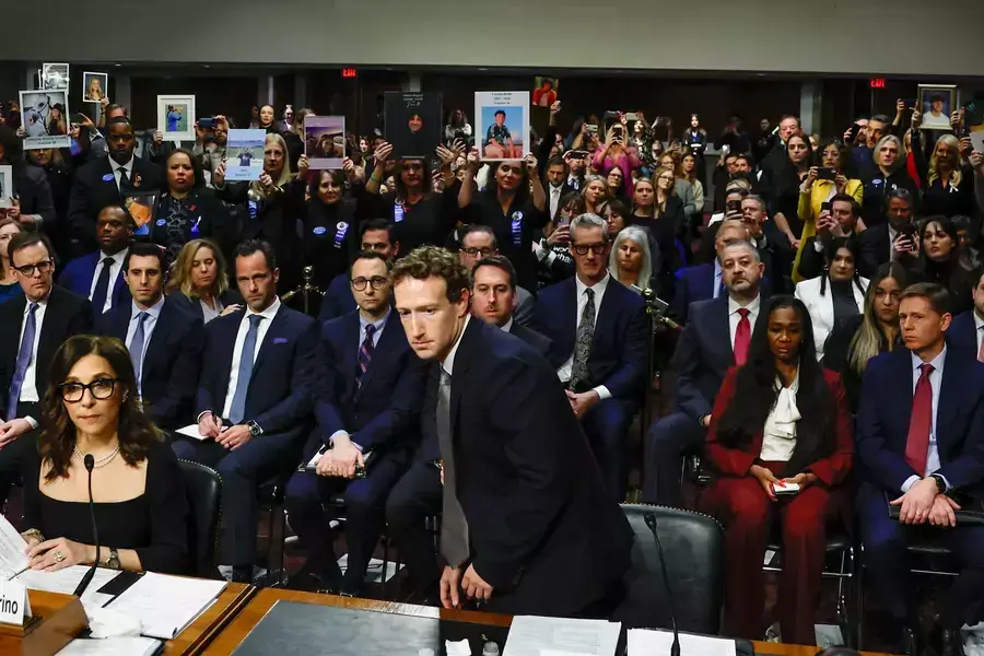 Meta's CEO Mark Zuckerberg returns to his seat after standing and facing the audience while he testified during the Senate Judiciary Committee hearing on online child sexual exploitation at the U.S. Capitol in Washington, D.C. on January 31, 2024