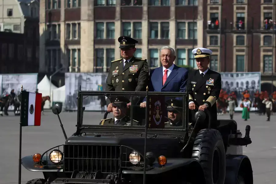 Mexico's President Andrés Manuel López Obrador attends a parade marking the 113th anniversary of the Mexican Revolution with his secretary of defense and secretary of the navy on November 20, 2023.