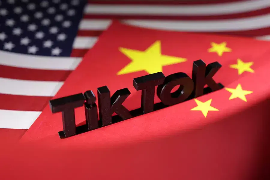 TikTok logo is placed on the U.S. and Chinese flags in this illustration.