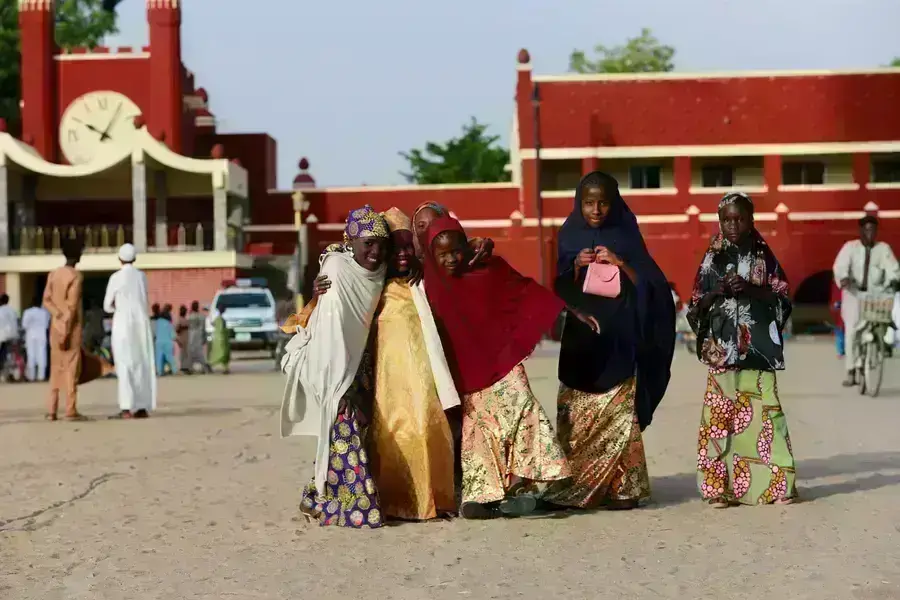 A group of girls stand near the Shehu of Borno's palace on the eve of the Eid- Al Fitr festival in Maiduguri, Nigeria 