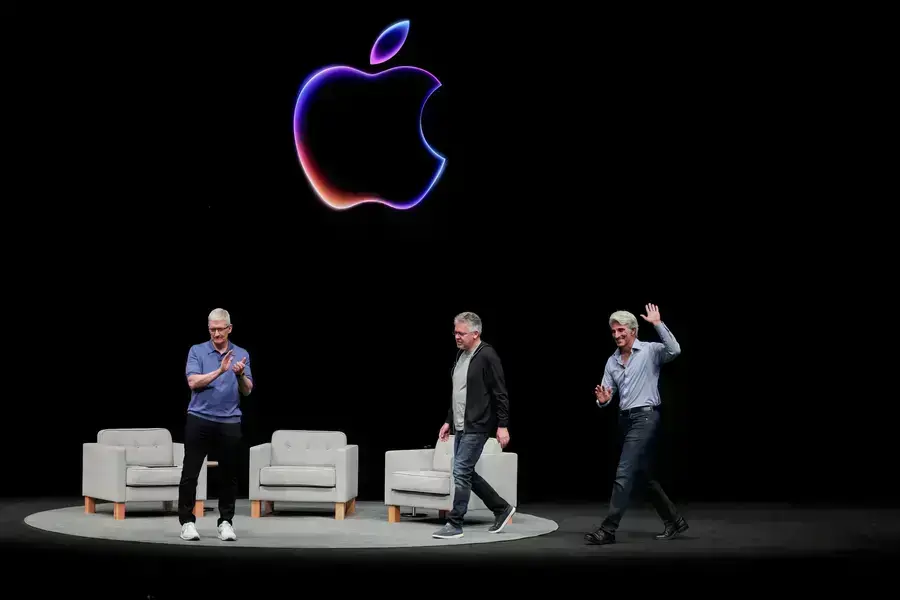Apple CEO Tim Cook attends a panel discussion with Craig Federighi and John Giannandrea during the annual developer conference event at the company's headquarters in Cupertino, California, U.S. on June 10, 2024