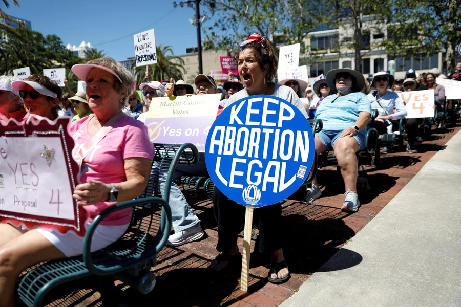 Abortion rights advocates gather to launch their 'Yes On 4' campaign with a march and rally against the six-week abortion ban ahead of November 5, when Florida voters will decide on whether there should be a right to abortion in the state, in Orlando, Flo