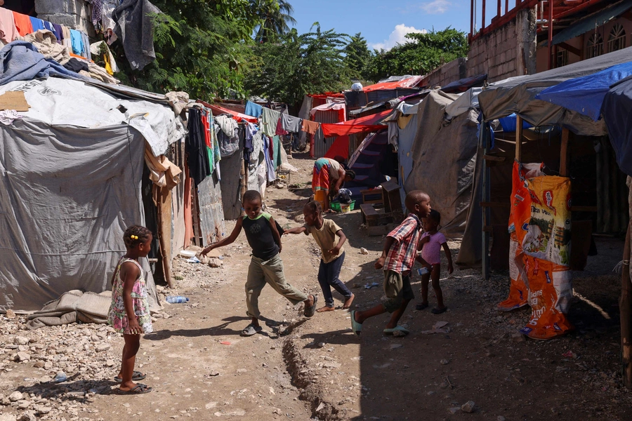 Children play in a refugee camp set up at a school for people displaced by gang violence, in Port-au-Prince, Haiti October 31, 2024. 