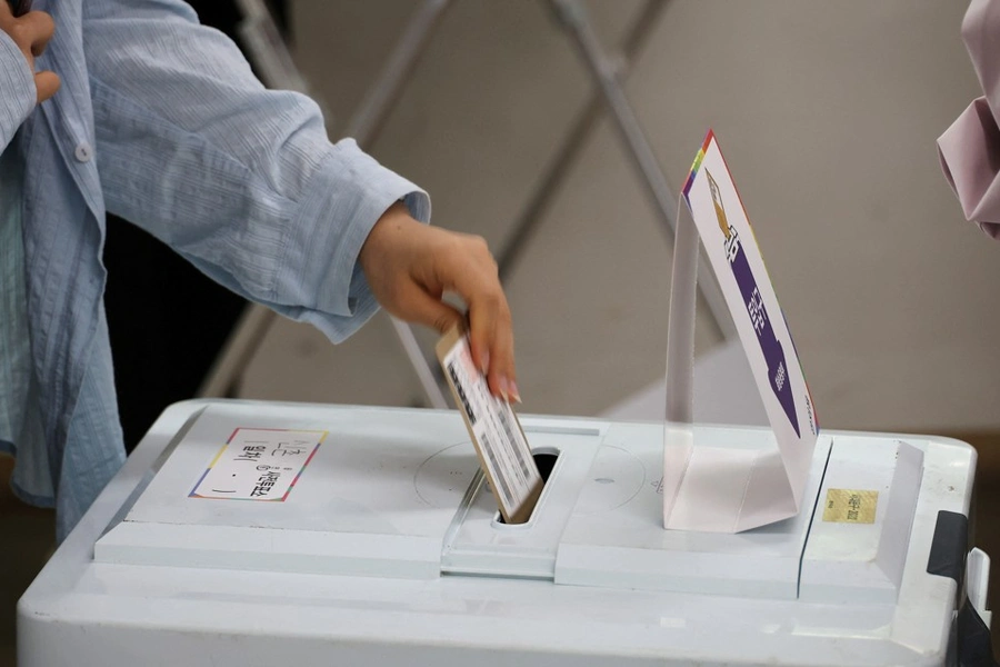 A woman casts her vote at a polling station in Seoul, South Korea, May 29, 2025. 