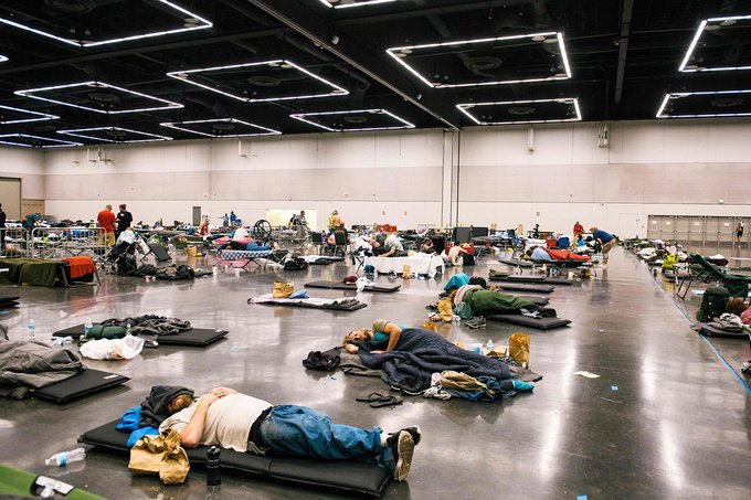 People rest at the Oregon Convention Center cooling station